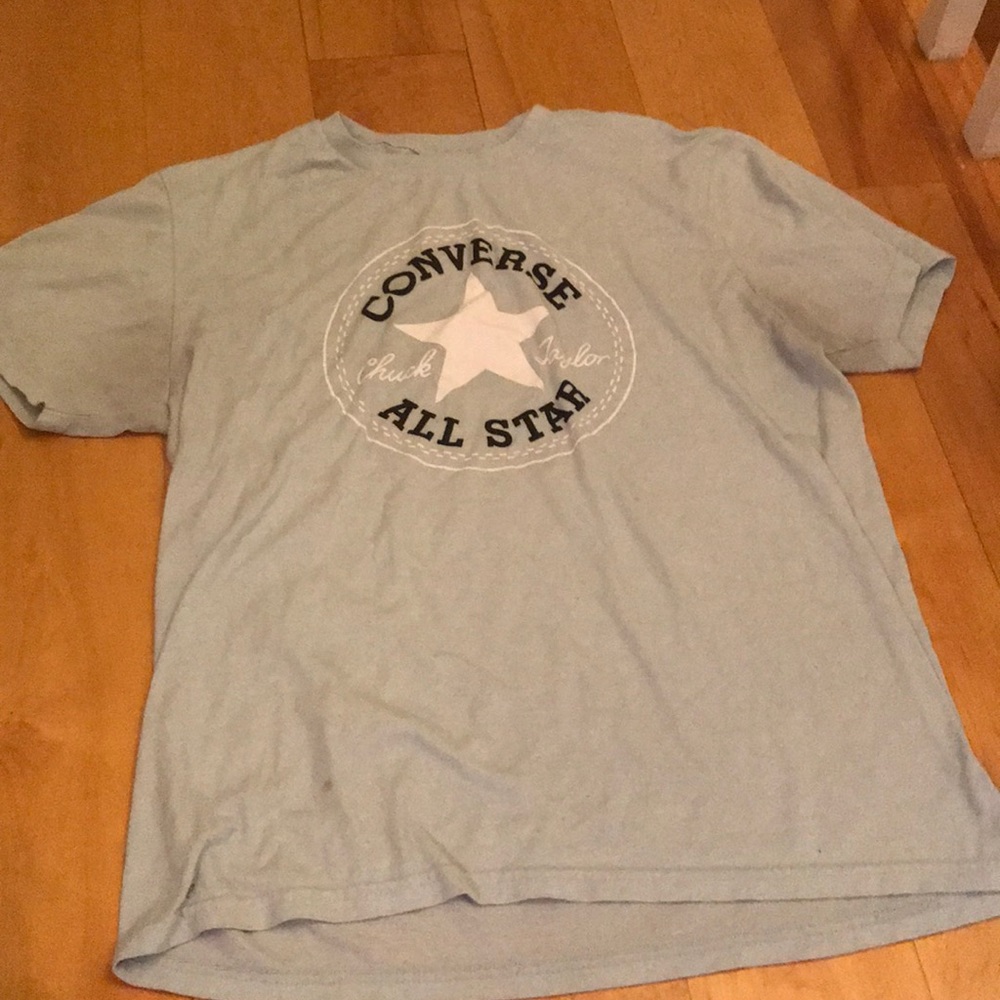 Light blue shirt w some stains from converse